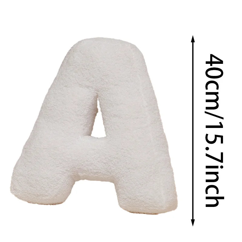 White letter 'A' pillow with dimensions on a white background